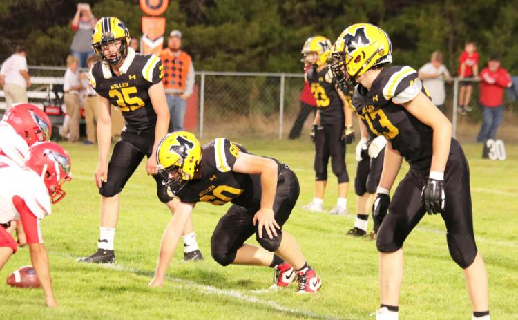 L-r: Cooper Walker, Daniel Wright and Jaylon Forsen on defense last Friday against Brady. Carolee Brown