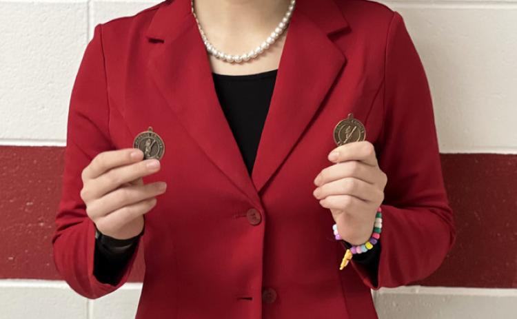 Simonson places at first speech meet