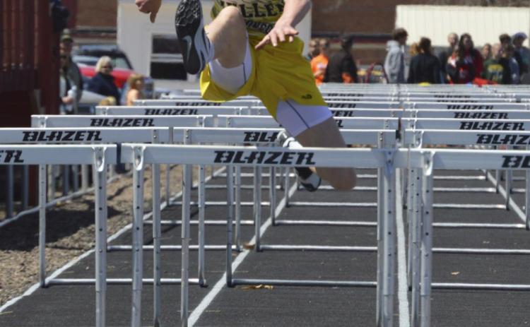 Above: Chase Gracey competes in the 110 hurdles on April 11 in Arnold. Right: Mercedes Garner in shot put action also in Arnold. Bri Moore