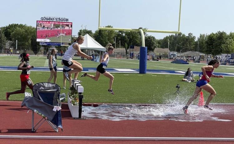 Josey French in midair during the steeplechase at Nationals. Leanne French