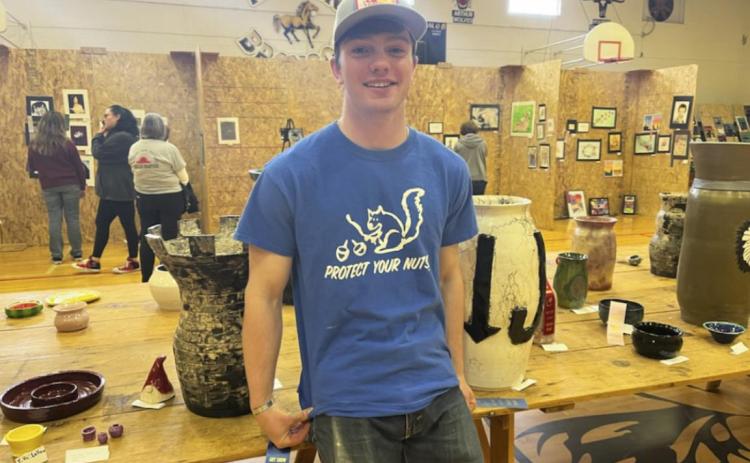 Senior Kyle Durfee is flanked by his two first place thrown pottery exhibits last Tuesday afternoon. Gerri Peterson