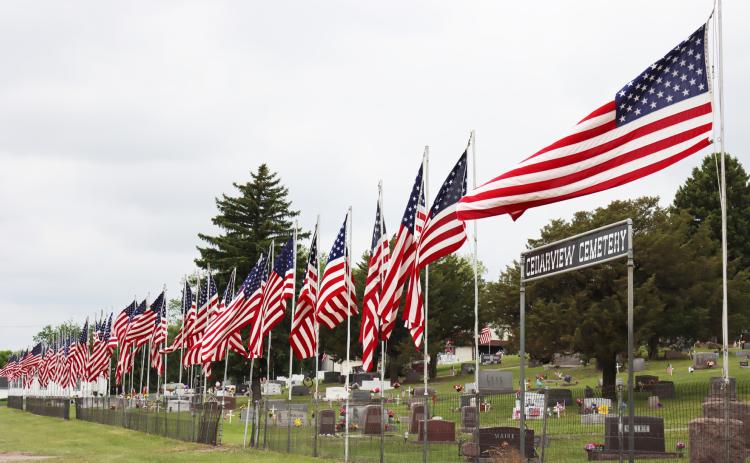 The flags flying at Cedarview Cemetery in Mullen over Memorial Day weekend. Every flag flown was once on a veteran’s casket, with the name of the veteran sewn onto the seam of the flag.