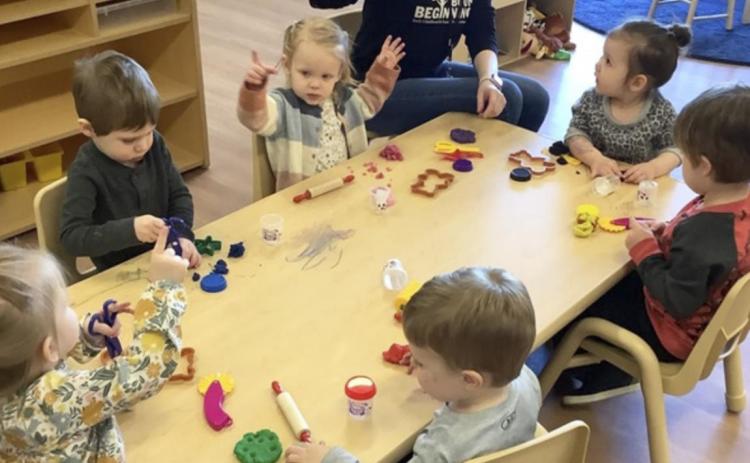 Teacher Ashley Gutierrez with her young students in a classroom at Boone Beginnings in Albion. Nearly two-dozen children are enrolled at the early childhood center, which opened in November. Center enrollment will soon expand – eight more babies, some of whom haven’t yet been born, are already signed up to receive child care at Boone Beginnings. Boone Beginnings