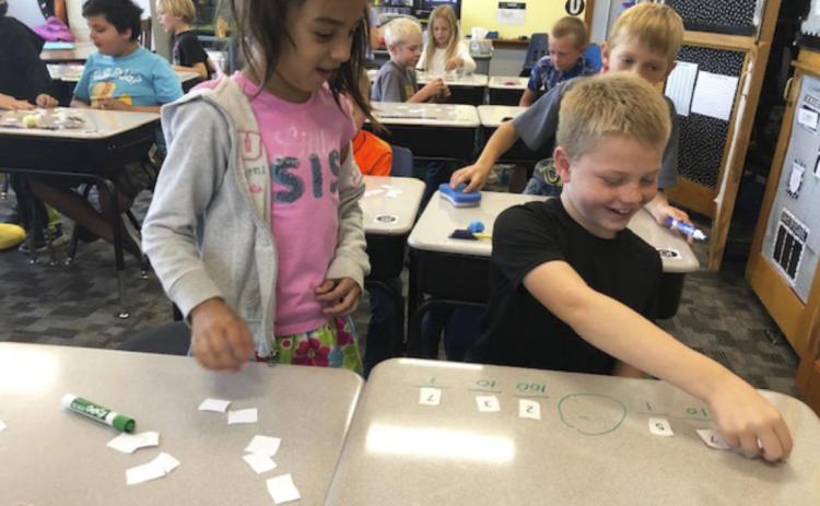 2nd graders compare 3-digit numbers