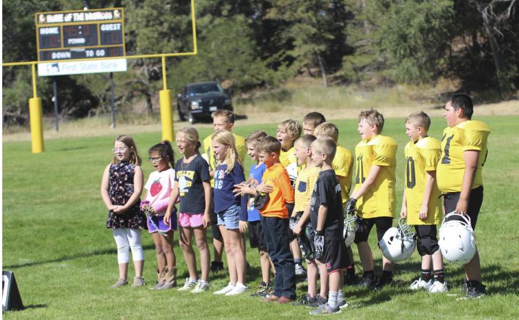 Some of the Mullen second and third graders sang the national anthem at the start of the Mullen youth football game against South Loup on Sunday, Sept. 25 with music teacher Caroline Durfee’s direction. Pictured front, l-r: Taylor Cash, Natalee Walker, Emri Dent, Elle Gracey, Tuff Pettit, Jaxyn Evans, Luke Cox, Ryden Ourada. Back: Caleb Deibler, Gus Wingebach, Cylas Dent, Kyler Marsh, Jackson Newman, Duke Miller, Hunter Gray. Gerri Peterson