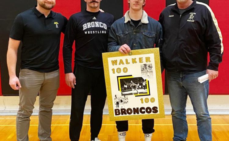 Cooper Walker with his coaches, l-r: Assistants Ty Kvanvig, Bo Pettit and Head Coach Russ Monette. courtesy photo