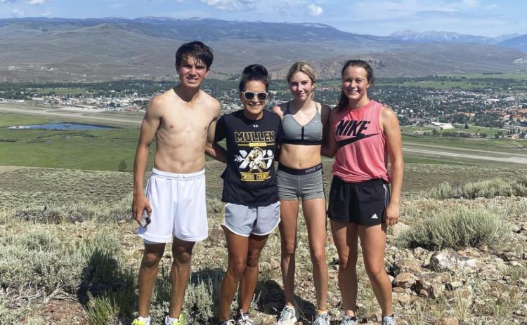 The team after their seven mile run that included running up W Mountain. Pictured l-r: Trevor Kuncl, Coach Janie Kuncl, Peyton Paxton, Callie Coble. courtesy photos
