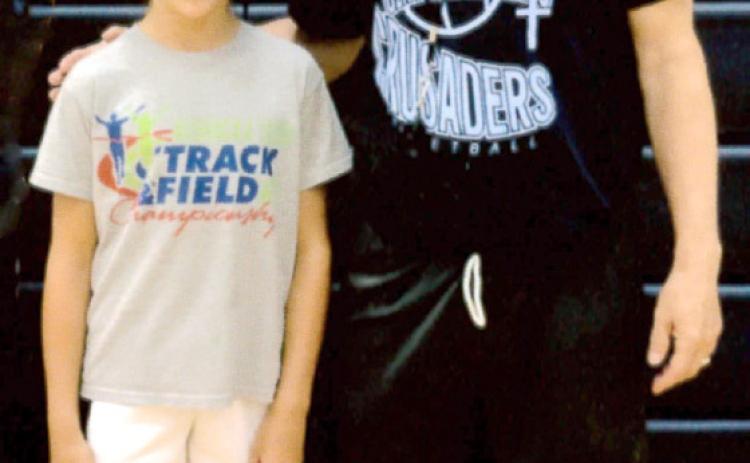 Mullen fourth grader Emri Dent attended the Mike Trader Mid-America Basketball Camp at Grand Island Central Catholic this summer. She brought home multiple awards in her Girls Midget League division: Most Valuable Camper, Three Point Champion, Scoring Leader for the Week, Nightly Scoring Leader, Nightly Assist Leader and All Star. Emri is pictured at the camp with Bill Gavers. courtesy photo