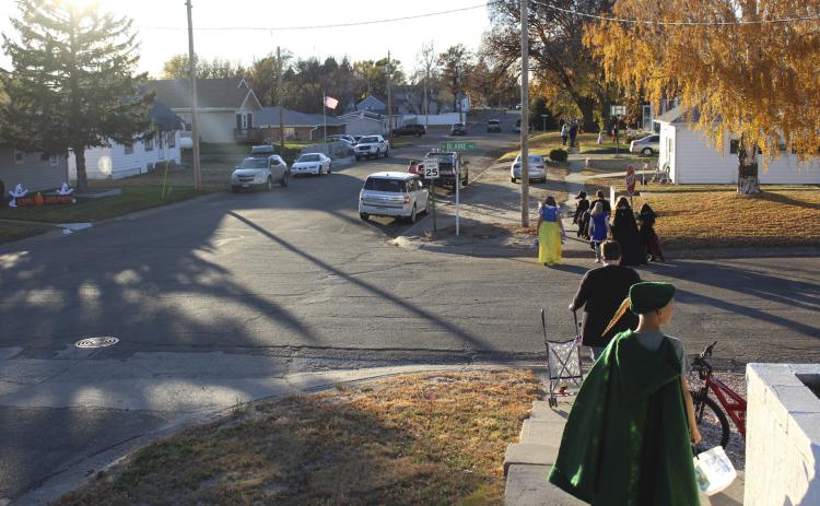 Trick-or-treaters could be seen for blocks down Mullen’s streets on a perfect Halloween evening Monday. At many houses those handing out candy were also out enjoying the weather, sitting on their steps, porches and decks. Gerri Peterson