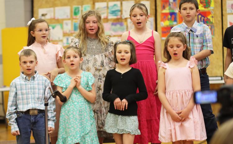 Back, l-r: 3rd graders Anna Hessin, Marki Finney, Sadie Hoyt and Marcus Lattin. Front, l-r: 2nd graders Trent Cox, Eve Ericksen, Ellie Licking and Aislynn Connealy during the Spring Music Concert last Tuesday, April 8. Gerri Peterson