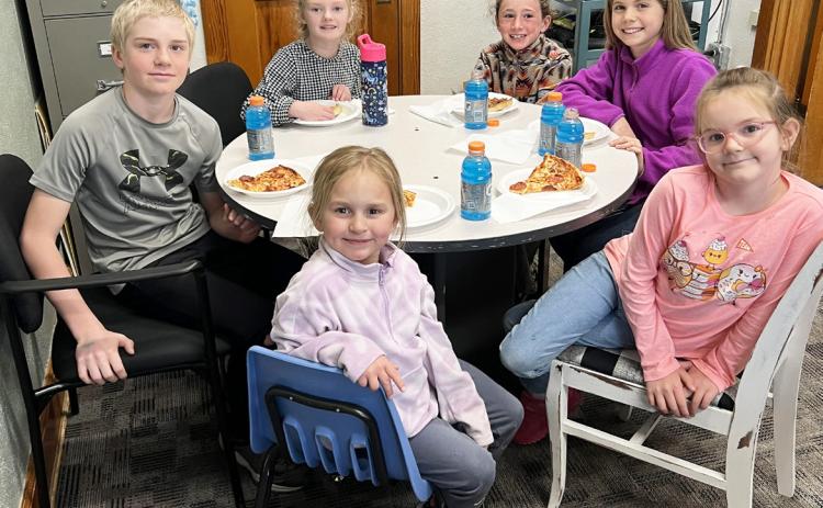 Pictured clockwise around the table from the left: Jedd Kraus, Anna Ridenour, Dailie Dent, Abbigail Mundorf, Anna Hessin, Doris Boland. Brett Mauler