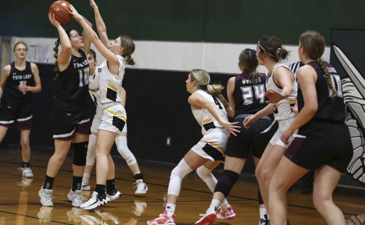 Erika Massey tries to prevent a Twin Loup shot last Monday.
