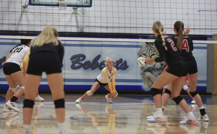 Tierston Moore with a dig last Tuesday at the triangular in Arnold. Megan Andersen