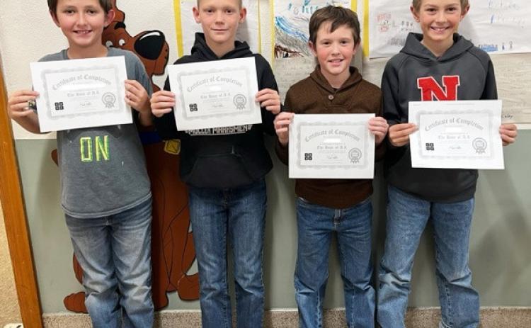 The 4th graders did a “Holiday Tech Puzzle Choice Board” in library class last Wednesday, Dec. 17 and the “Grinch Hour of Code” was one of the options. These four students (pictured l-r: Marcus Lattin, Eli Barnes, Holt Morrison and Grady Phipps) completed all 20 levels of creating a basic block code featuring the Grinch and other characters from the new animated Grinch movie. Each level had a different challenge for them to complete by creating the code for the task. Emily Stichka