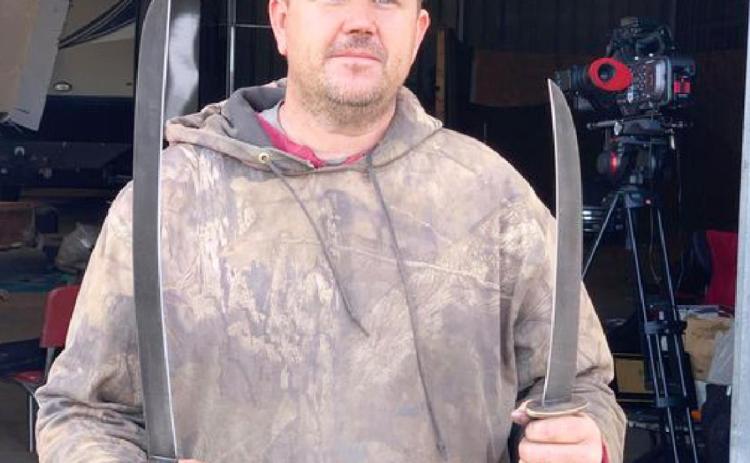 Chris O’Brien with the ginunting swords he made at his home forge in the third and final round of Forged in Fire. courtesy photo