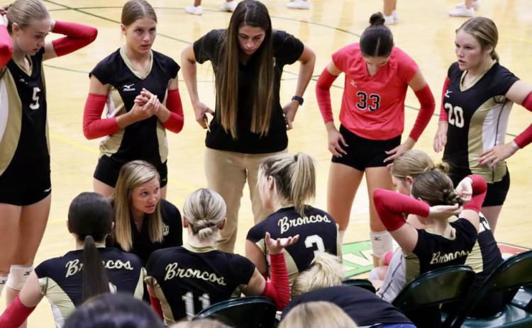 Head Coach Nichole Ourada talks to her team last Tuesday at North Platte St. Pat’s. Sue Licking