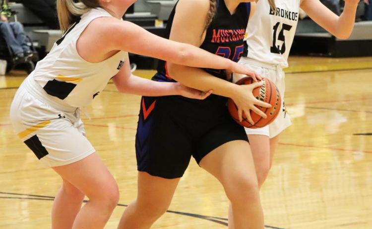 Hayley Donohoe (left) and Brynne McCully fight for the ball against Gordon-Rushville last Thursday. Sue Licking
