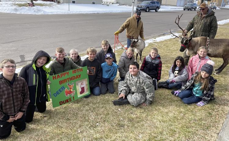 Mullen 4th grader Duke Miller had an early birthday surprise last Thursday, Nov. 30 when Flip Licking’s Stable Productions’ reindeer showed up at school to visit. Duke is pictured holding his sign, “Happy 10th Birthday ‘Deer’ Duke” with his classmates.