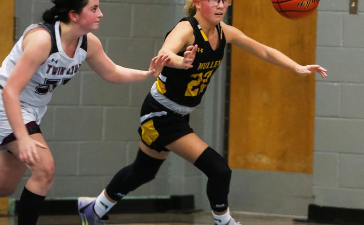 Riley Hegland keeps her eyes on the ball as she chases it down against Twin Loup last week. Megan Andersen