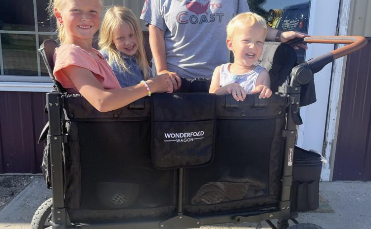 Jessica Polt and her Wonderfold Wagon with Danielle Peterson and Aurora and Arthur Polt riding along. Gerri Peterson