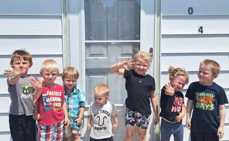 Sometimes it’s hard seeing our mommies and daddies leave to go to work, so that’s why at Lots of Love Day Care children have the Goodbye Mat! Pictured l-r: Chasin McIntosh, Mason Deibler, Ronin Lattin, Axton Stichka, Violet Stichka, Ady McIntosh, Aiden Stichka. Lori Freeze