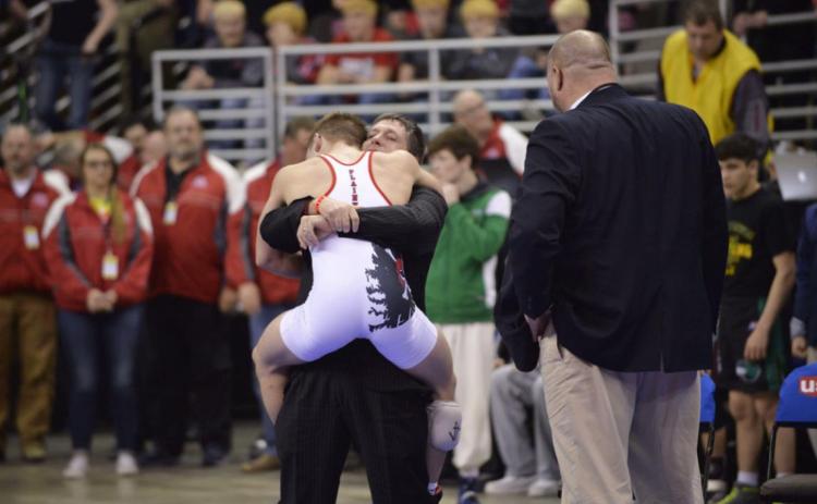 Plainview wrestling coach Dean Boyer hugs Christian Miller after the senior capped an undefeated season by winning the Class D 138-pound championship at the State Wrestling Tournament in Omaha in this February 2017 photo. Darin Epperly/Daily News