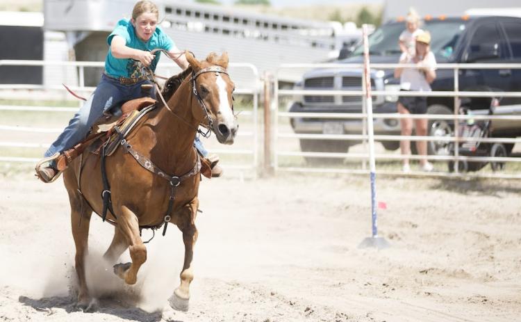 Marki Finney running the poles during Rodeo Bible Camp. Suzie/Casey Wahlgren