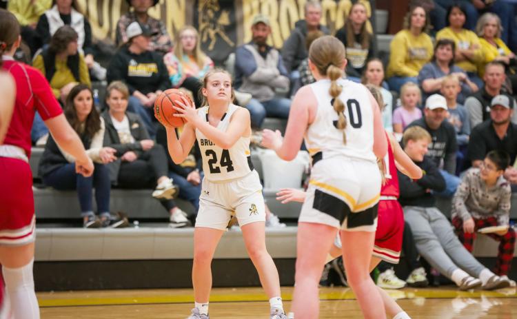 Lauren Schoonveld looks for a teammate to pass to last week against Valentine.