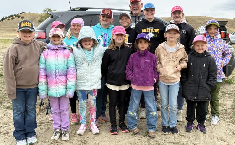 Girl Scout Day Camp participants, back, l-r: Anna Hessin (peeking), Daryl Deibler, Ella Walz, Danielle Peterson, Maci Walz, Ava Walz, Aislynn Connealy. Front: Harper Myers, Rhyme Pettit, Ryann Walz, Kinley Crisp, Addison Mundorf, Brystol Call, Violet Stichka. Bill Williams standing tall in the back! And, yes, it was a little chilly but the girls learned to dress in layers. Sooky Marks