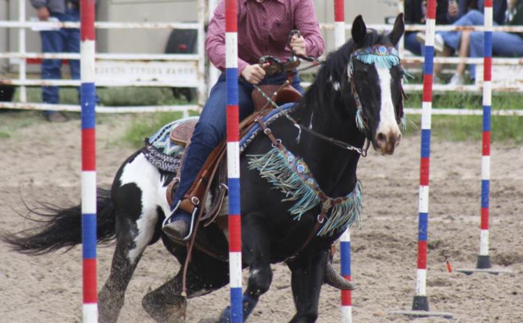 Faith Miller runs poles at Thedford. Tami Miller
