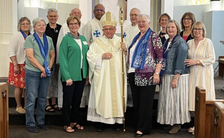 Back, l-r: Julie Gehrig, Sharon Swett, Father Lou Nollette, Father Vijumon, Father Dave Rykwalter, Deb Kearns, Marylin Ericksen. Front: Cheryl Perkins, Sandy Eggert, Bishop Hannefelt, Darleen Schulte, Judy Schwartz, Loretta Hamilton. courtesy photo