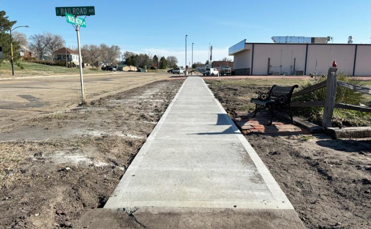 A long overdue improvement was recently made to the sidewalk on the south side of the railroad tracks, which had bulged up many years ago, by Licking Redi-Mix and Licking Construction. Gerri Peterson