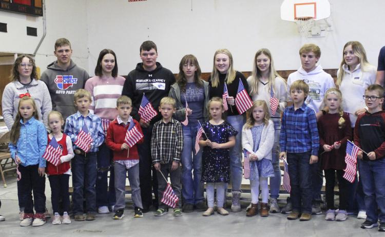 The tradition of the Mullen seniors singing with the kindergartners at the Veterans Day program continues! Pictured back, l-r: Kierstin Pike, Corynn Corbin, James Kessler, Ashlyn Simonson, Owen Thorberg, Malia Oltmer, Samantha Cheever, Erika Massey, Kyle Finney, Lauren Schoonveld, Chase Gracey. Front: Brogan Jewell, Aurora Polt, Merick Lattin, Tate Phillips, Jaxson Barnes, Kinley Crisp, Meyer Vinton, Kayden Evans, Anna Ridenour, Cooper Ourada. Gerri Peterson