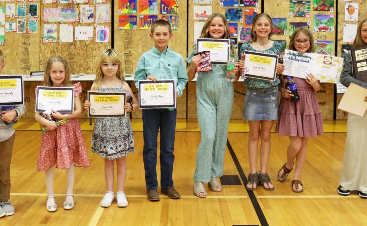 Elementary award recipients, l-r: Finnegan Connealy, Aurora Polt, Nora Pohot, Grady Phipps, Ella Walz, Kendall Phipps, Avery Vinton, Emri Dent. Gerri Peterson