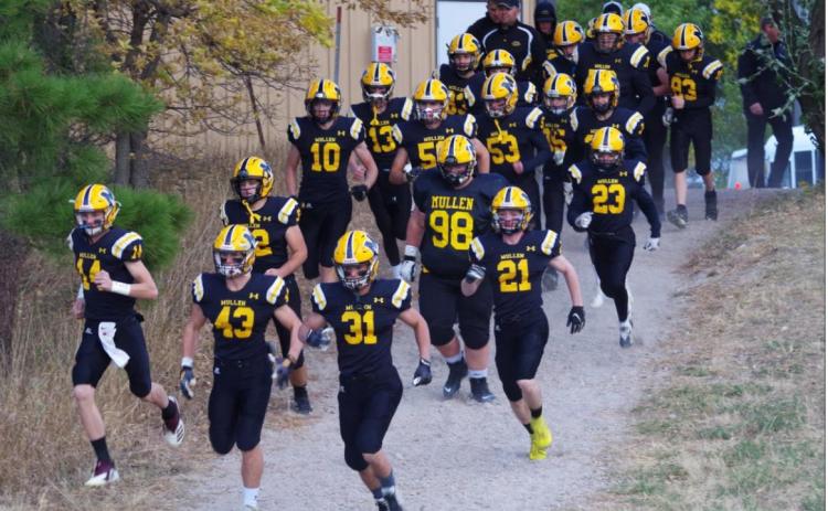 Like so many Broncos before them, the football team runs down the hill to their home field before last week’s game. Barb McIntosh