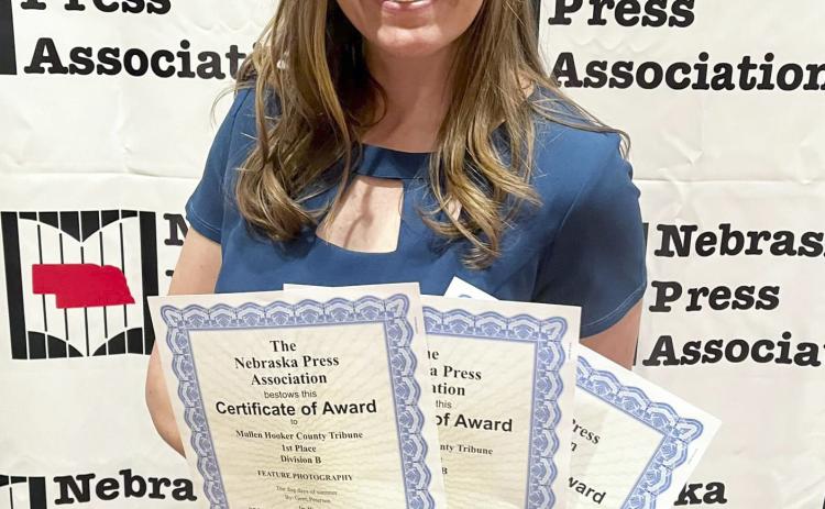 Gerri Peterson with her Better Newspaper Contest awards last Saturday in Lincoln. Amy Johnson