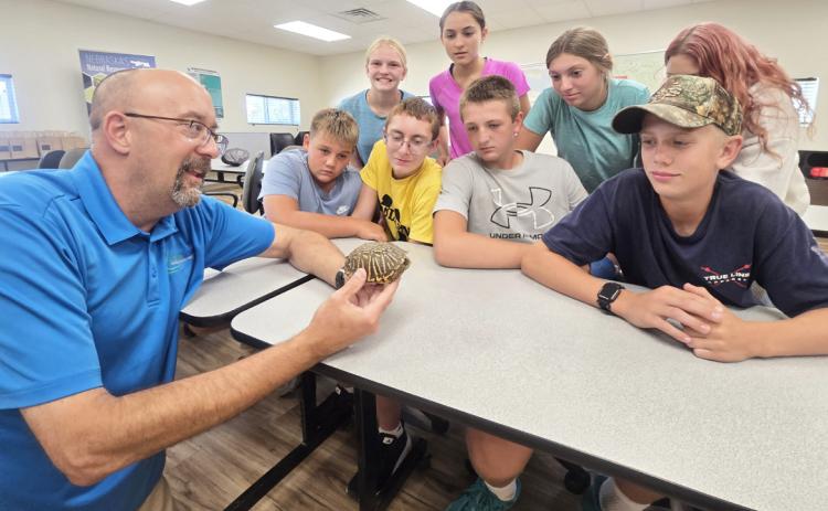 Last Wednesday, Aug. 26, the Mullen 8th graders attended the Upper Loup NRD field day in Thedford. They attended seven sessions that included forestry, wildlife, water, soils, range, NRD and biodiversity. It was an educational and fun day. Pictured at the session with Alan Bartels are Carson Hegland, Ava Walz, Cooper Cash, Luciana Gonzalez, Hayden Deibler, Olivia Cox, Bella Coetzee and Weston Ourada. Tawn Jewell