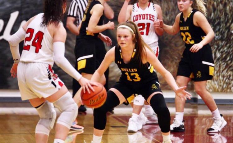 Kylie Licking on defense at Anselmo-Merna last Friday. Also pictured for the Broncos are Samantha Moore and Taylor Svoboda. Sue Licking