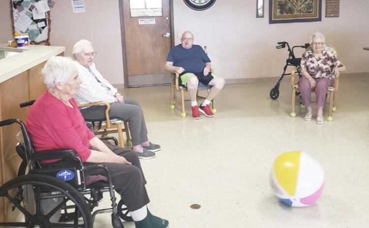 L-r: Marlene Dykes, Minnie Mary Hamilton, Bob Osterman and Nadene Andersen playing kickball with Gini Corbin.