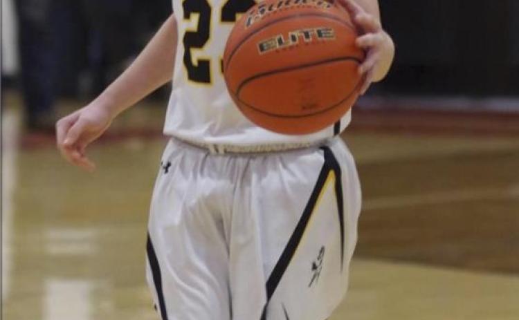 Kyle Finney brings the ball down the court last Saturday. Barb McIntosh