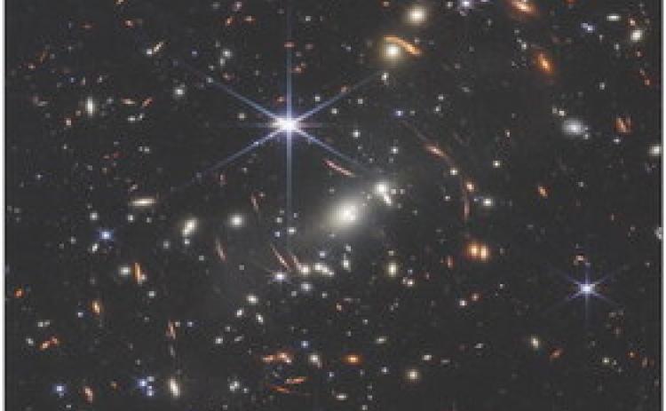 NASA’s James Webb Space Telescope has produced the deepest and sharpest infrared image of the distant universe to date. Known as Webb’s First Deep Field, this image of galaxy cluster SMACS 0723 is overflowing with detail. This slice of the vast universe is approximately the size of a grain of sand held at arm’s length by someone on the ground. NASA, ESA, CSA, STScl