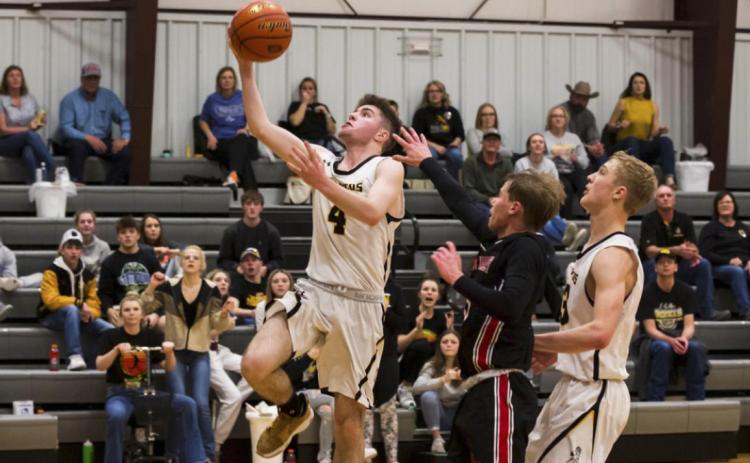 Luke Durfee goes up for a layup against Sandhills Valley. Shelby Welsh