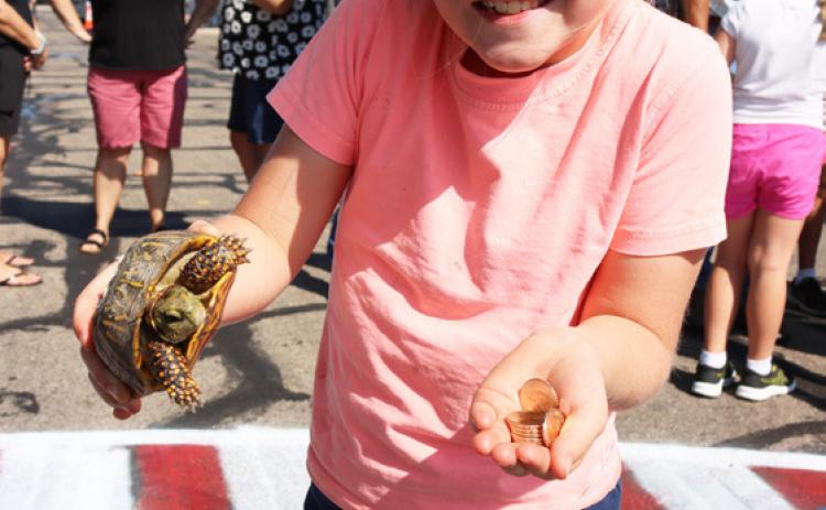 Eve Ericksen with her turtle who won the overall race. Gerri Peterson