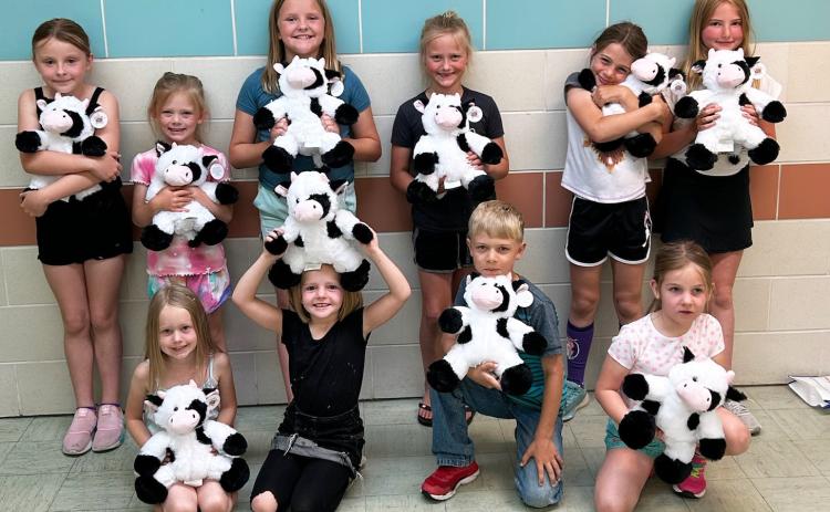 Julie Pfeiffer The Summer Reading Program, “Adventure Begins at Your Library” was held at the Hooker County Library on June 6. Participants are pictured with the cows they made during the morning and got to take home with them, back l-r: Sadie Hoyt, Brystol Call, Ella Walz, Danielle Peterson, Keira Kearns, Elle Gracey. Front: Aurora Polt, Ryann Walz, Killian Kearns, Eve Ericksen.