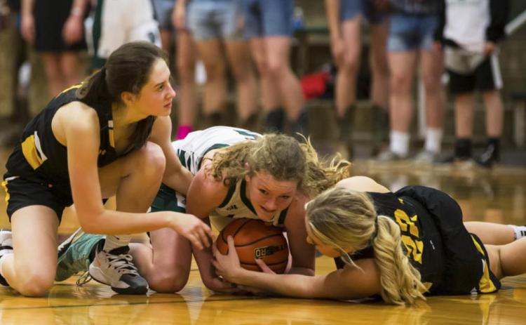 Allie Boyer (left) and Taylor Svoboda fight for a lose ball against Sandhills/Thedford last Thursday.