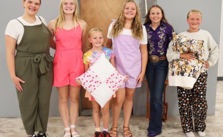 Public Fashion Show participants, l-r: Maci Walz, Ava Walz, Ryann Walz, Ella Walz, Audrabell Werth, Danielle Peterson. Gerri Peterson