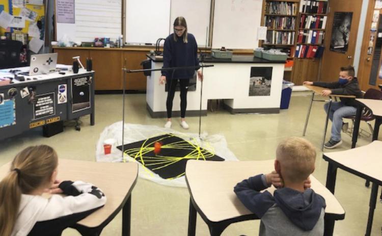 MHS senior Josey French taught the students about pendulums. Emily Brown