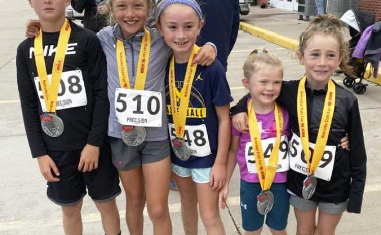 Mullen was well represented at the Nebraska State Fair races on Saturday, Aug. 26. Pictured left to right are the youth who competed in the 1 Mile - Cylas Dent (1st overall), Emri Dent (4th overall, 1st female), Avery Vinton (7th overall, 2nd female), Meyer Vinton and Dailie Dent. In the Marathon Relay, the Sandhillers team consisting of Tara Call, Callie Vinton, Brynn Burney and Kay Dent won the female division and placed 6th overall. Kay Dent