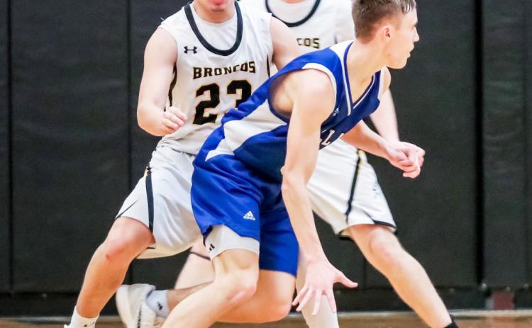 Nick Gonzalez plays defense against Wallace last Thursday. Carolee Brown Photography
