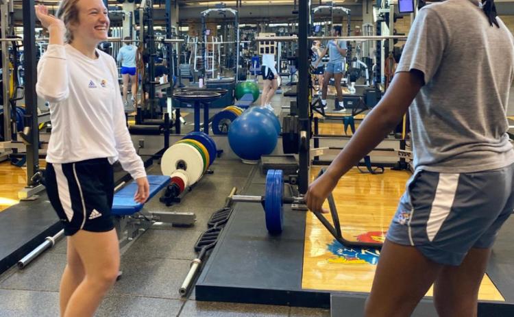 Ally Ginkens working with a tennis athlete at the University of Kansas. courtesy photo